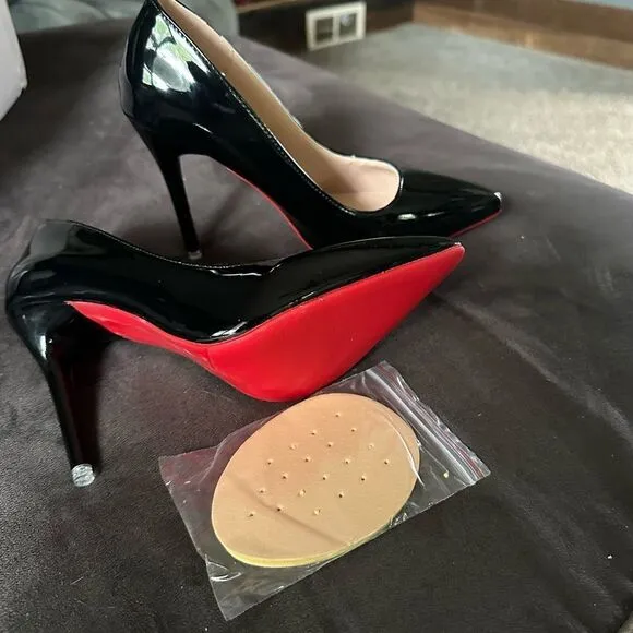 Black patent leather, high heels with red bottom.I get so many compliments
