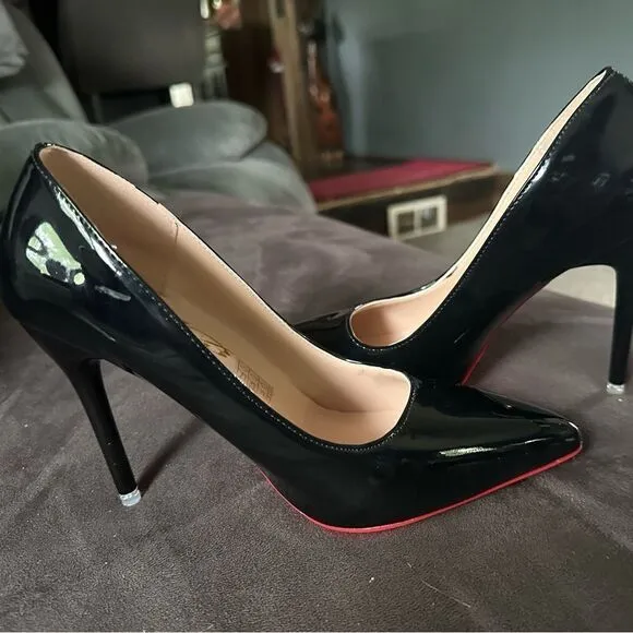 Black patent leather, high heels with red bottom.I get so many compliments