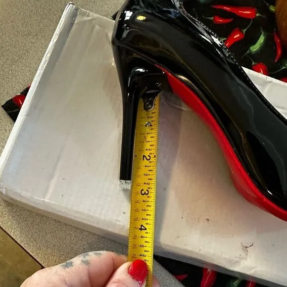 Black patent leather, high heels with red bottom.I get so many compliments