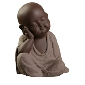 Buddha Statuette and the Monk in Grey