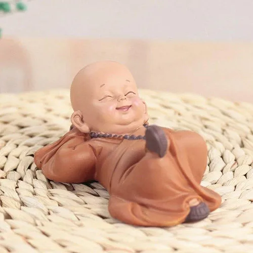 Buddha Statuette with Lying Monks