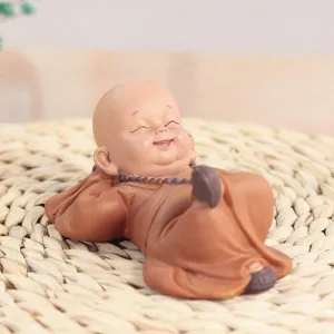 Buddha Statuette with Lying Monks